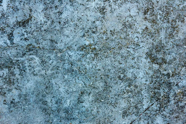 Çatlakları ve çizikleri olan beton bir duvarın dokusu arka plan olarak kullanılabilir.