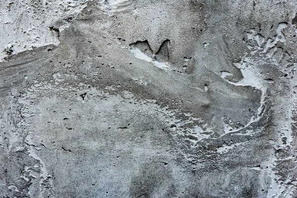 Çatlakları ve çizikleri olan beton bir duvarın dokusu arka plan olarak kullanılabilir.