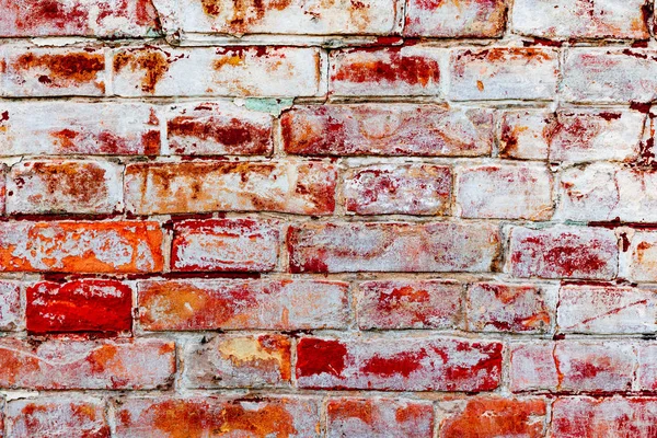 Çatlakları ve çizikleri olan tuğla duvar dokusu arka plan olarak kullanılabilir.