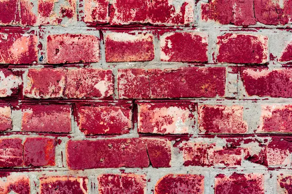 Çatlakları ve çizikleri olan tuğla duvar dokusu arka plan olarak kullanılabilir.