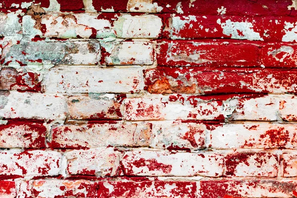 Çatlakları ve çizikleri olan tuğla duvar dokusu arka plan olarak kullanılabilir.