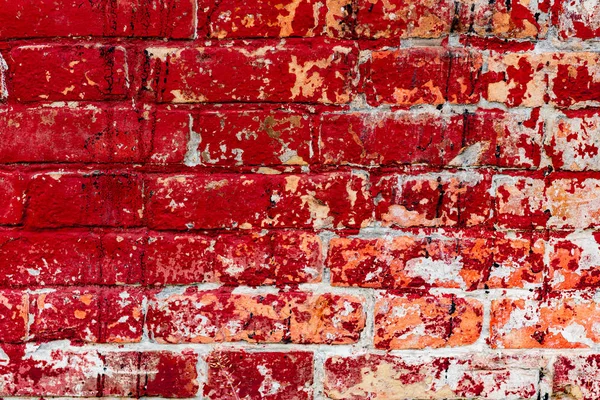 Çatlakları ve çizikleri olan tuğla duvar dokusu arka plan olarak kullanılabilir.