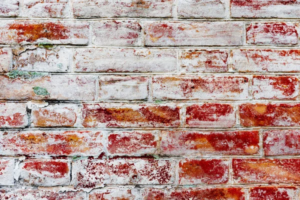 Çatlakları ve çizikleri olan tuğla duvar dokusu arka plan olarak kullanılabilir.