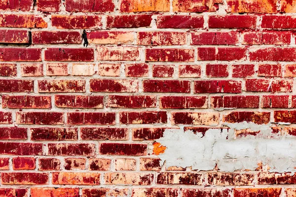 Çatlakları ve çizikleri olan tuğla duvar dokusu arka plan olarak kullanılabilir.