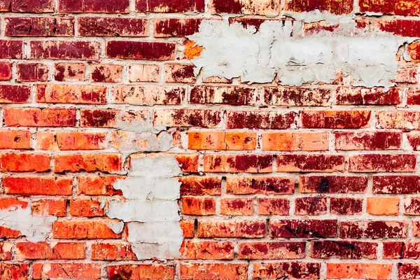 Çatlakları ve çizikleri olan tuğla duvar dokusu arka plan olarak kullanılabilir.