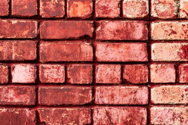 Çatlakları ve çizikleri olan tuğla duvar dokusu arka plan olarak kullanılabilir.