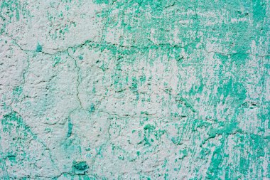 Çatlakları ve çizikleri olan beton bir duvarın dokusu arka plan olarak kullanılabilir.
