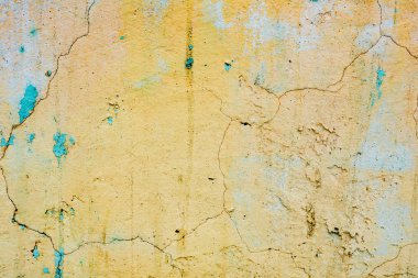 Çatlakları ve çizikleri olan beton bir duvarın dokusu arka plan olarak kullanılabilir.