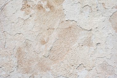 Çatlakları ve çizikleri olan beton bir duvarın dokusu arka plan olarak kullanılabilir.