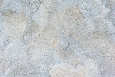 Çatlakları ve çizikleri olan beton bir duvarın dokusu arka plan olarak kullanılabilir.