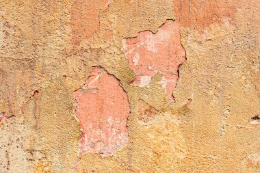 Çatlakları ve çizikleri olan beton bir duvarın dokusu arka plan olarak kullanılabilir.