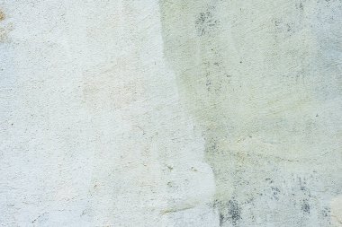 Çatlakları ve çizikleri olan beton bir duvarın dokusu arka plan olarak kullanılabilir.