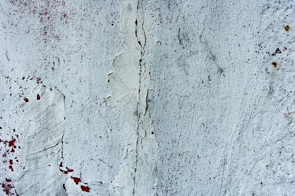 Çatlakları ve çizikleri olan beton bir duvarın dokusu arka plan olarak kullanılabilir.