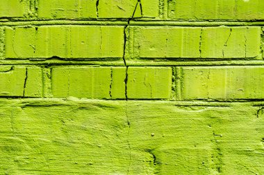 Çatlakları ve çizikleri olan tuğla duvar dokusu arka plan olarak kullanılabilir.