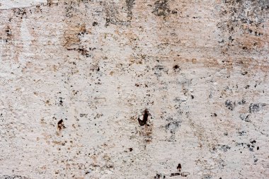 Çatlakları ve çizikleri olan beton bir duvarın dokusu arka plan olarak kullanılabilir.