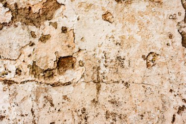 Çatlakları ve çizikleri olan beton bir duvarın dokusu arka plan olarak kullanılabilir.