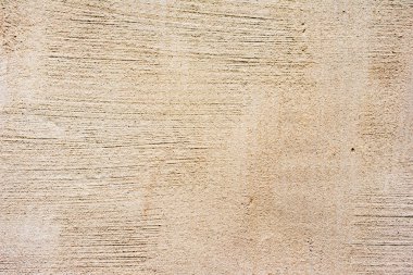 Çatlakları ve çizikleri olan beton bir duvarın dokusu arka plan olarak kullanılabilir.