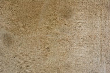 Çatlakları ve çizikleri olan beton bir duvarın dokusu arka plan olarak kullanılabilir.