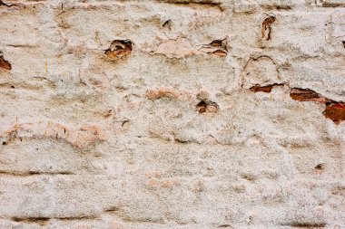 Çatlakları ve çizikleri olan beton bir duvarın dokusu arka plan olarak kullanılabilir.