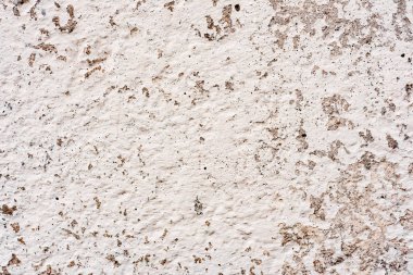 Çatlakları ve çizikleri olan beton bir duvarın dokusu arka plan olarak kullanılabilir.