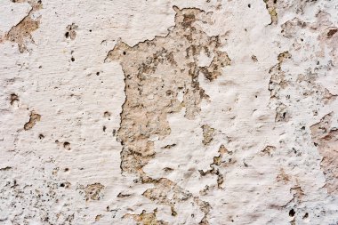 Çatlakları ve çizikleri olan beton bir duvarın dokusu arka plan olarak kullanılabilir.