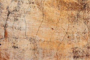 Çatlakları ve çizikleri olan beton bir duvarın dokusu arka plan olarak kullanılabilir.