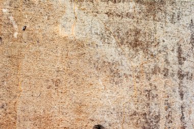 Çatlakları ve çizikleri olan beton bir duvarın dokusu arka plan olarak kullanılabilir.