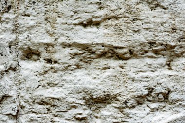 Çatlakları ve çizikleri olan beton bir duvarın dokusu arka plan olarak kullanılabilir.