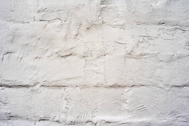 Çatlakları ve çizikleri olan tuğla duvar dokusu arka plan olarak kullanılabilir.