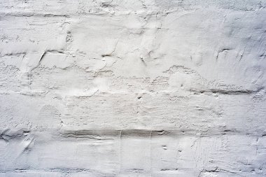 Çatlakları ve çizikleri olan tuğla duvar dokusu arka plan olarak kullanılabilir.