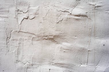 Çatlakları ve çizikleri olan beton bir duvarın dokusu arka plan olarak kullanılabilir.