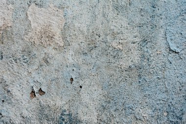 Çatlakları ve çizikleri olan beton bir duvarın dokusu arka plan olarak kullanılabilir.
