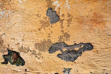 Çatlakları ve çizikleri olan beton bir duvarın dokusu arka plan olarak kullanılabilir.