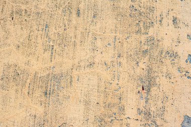 Çatlakları ve çizikleri olan beton bir duvarın dokusu arka plan olarak kullanılabilir.