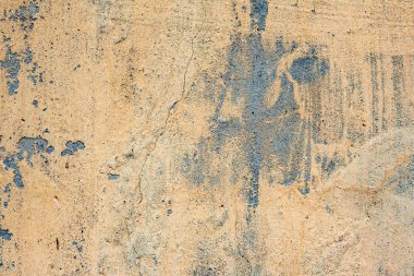 Çatlakları ve çizikleri olan beton bir duvarın dokusu arka plan olarak kullanılabilir.