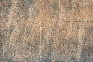 Çatlakları ve çizikleri olan beton bir duvarın dokusu arka plan olarak kullanılabilir.