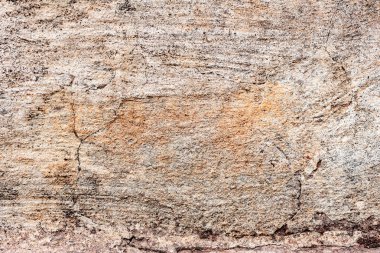 Çatlakları ve çizikleri olan beton bir duvarın dokusu arka plan olarak kullanılabilir.