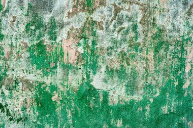 Çatlakları ve çizikleri olan beton bir duvarın dokusu arka plan olarak kullanılabilir.