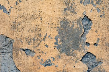 Çatlakları ve çizikleri olan beton bir duvarın dokusu arka plan olarak kullanılabilir.