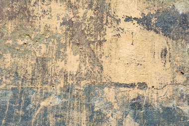 Çatlakları ve çizikleri olan beton bir duvarın dokusu arka plan olarak kullanılabilir.