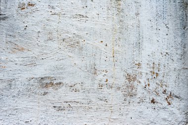 Çatlakları ve çizikleri olan beton bir duvarın dokusu arka plan olarak kullanılabilir.