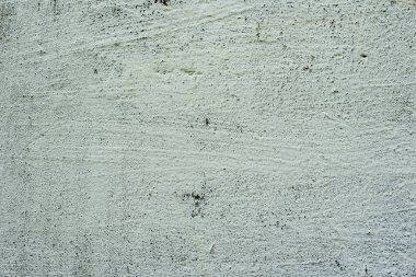 Çatlakları ve çizikleri olan beton bir duvarın dokusu arka plan olarak kullanılabilir.