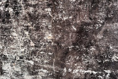 Çatlakları ve çizikleri olan beton bir duvarın dokusu arka plan olarak kullanılabilir.