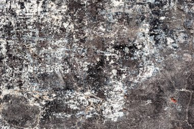 Çatlakları ve çizikleri olan beton bir duvarın dokusu arka plan olarak kullanılabilir.