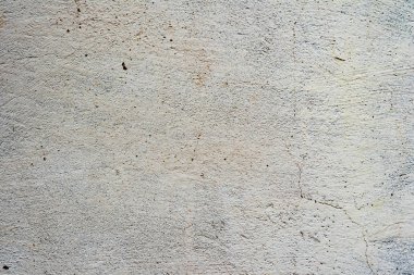 Çatlakları ve çizikleri olan beton bir duvarın dokusu arka plan olarak kullanılabilir.