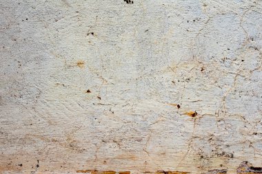 Çatlakları ve çizikleri olan beton bir duvarın dokusu arka plan olarak kullanılabilir.