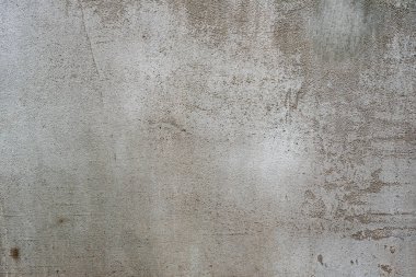 Çatlakları ve çizikleri olan beton bir duvarın dokusu arka plan olarak kullanılabilir.