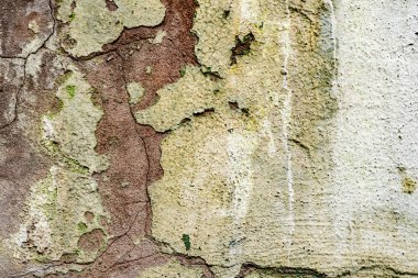 Çatlakları ve çizikleri olan beton bir duvarın dokusu arka plan olarak kullanılabilir.