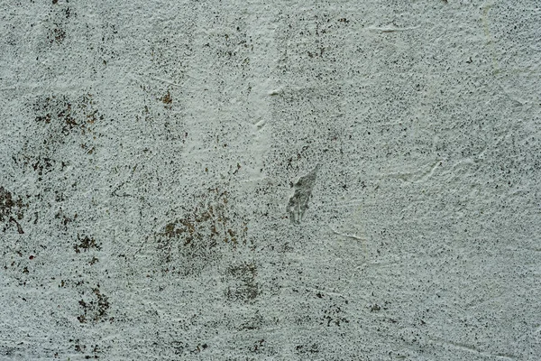 Çatlakları ve çizikleri olan beton bir duvarın dokusu arka plan olarak kullanılabilir.