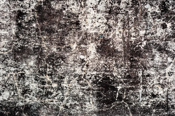 Çatlakları ve çizikleri olan beton bir duvarın dokusu arka plan olarak kullanılabilir.